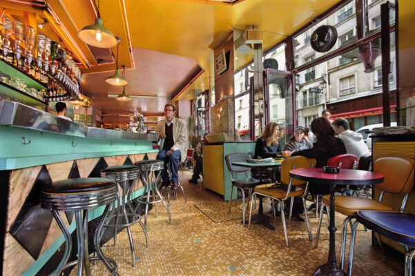 People sitting inside French cafe