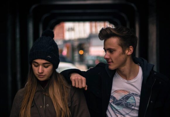 Teenage couple-Boy looking at girl