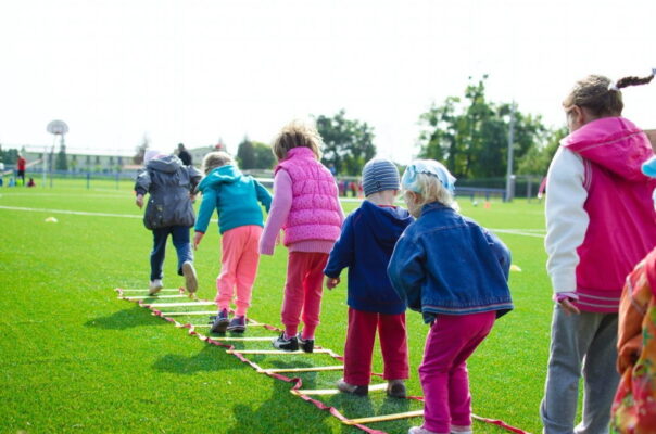 Children having outdoor gymnastics class