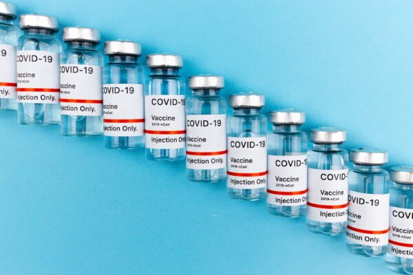 covid-19 vaccine ampoules in a row