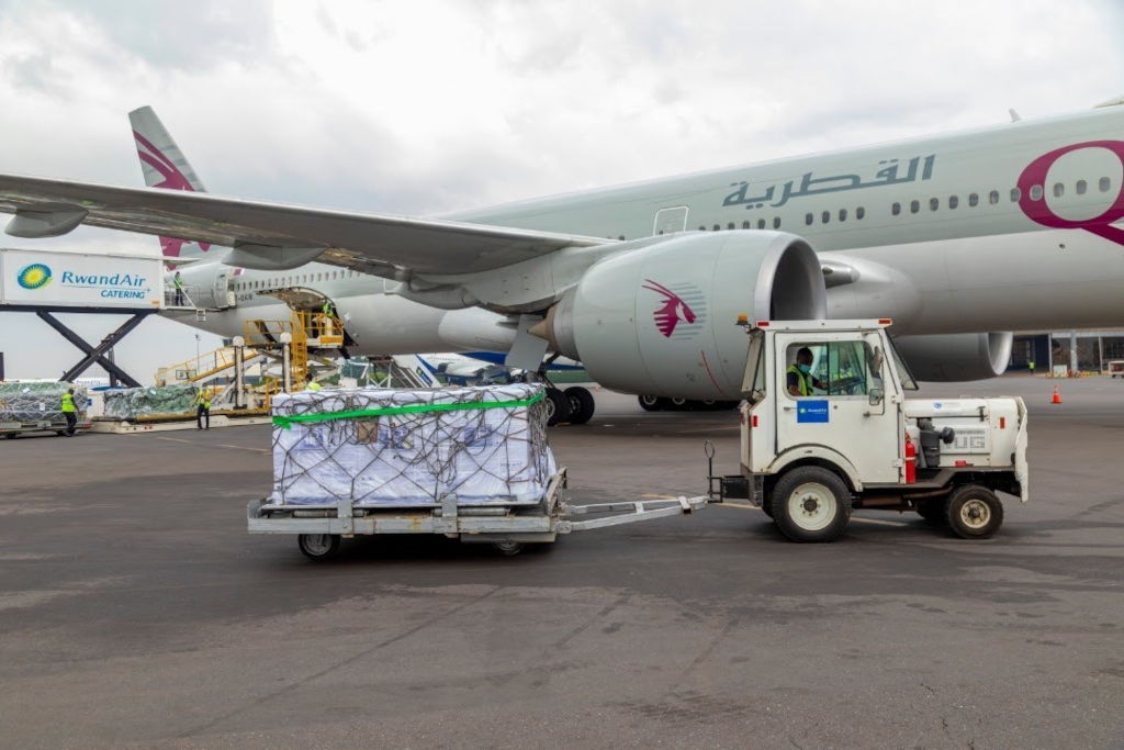 Vaccines are unloaded from an airplane
