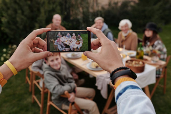 Someone taking a family dinner photo