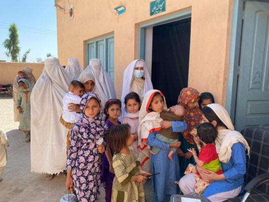 Mothers in Pakistan bring their children for vaccination. (Photo credit: Huma Khawar)