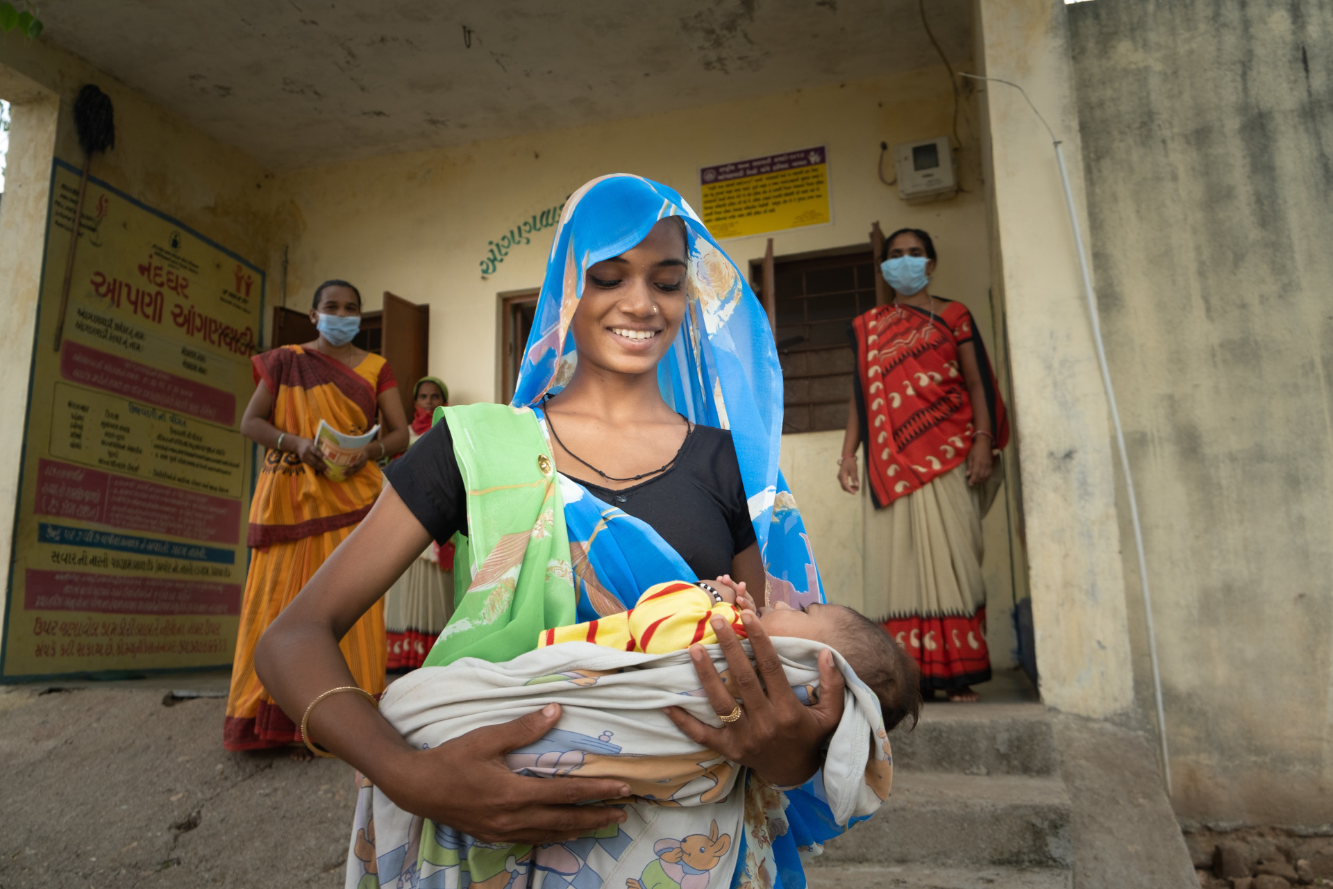 Varsha with her son Himanshu (2 monhts) at Mamta Diwas (VHND) session, after Himanshu was given the Penta vaccine. Location: Village Kundli, Raibar, Dahod, Gujarat.