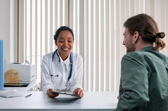 A medical doctor having a patient consult