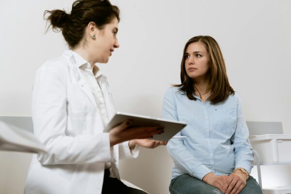A health professional talking to pregnant woman