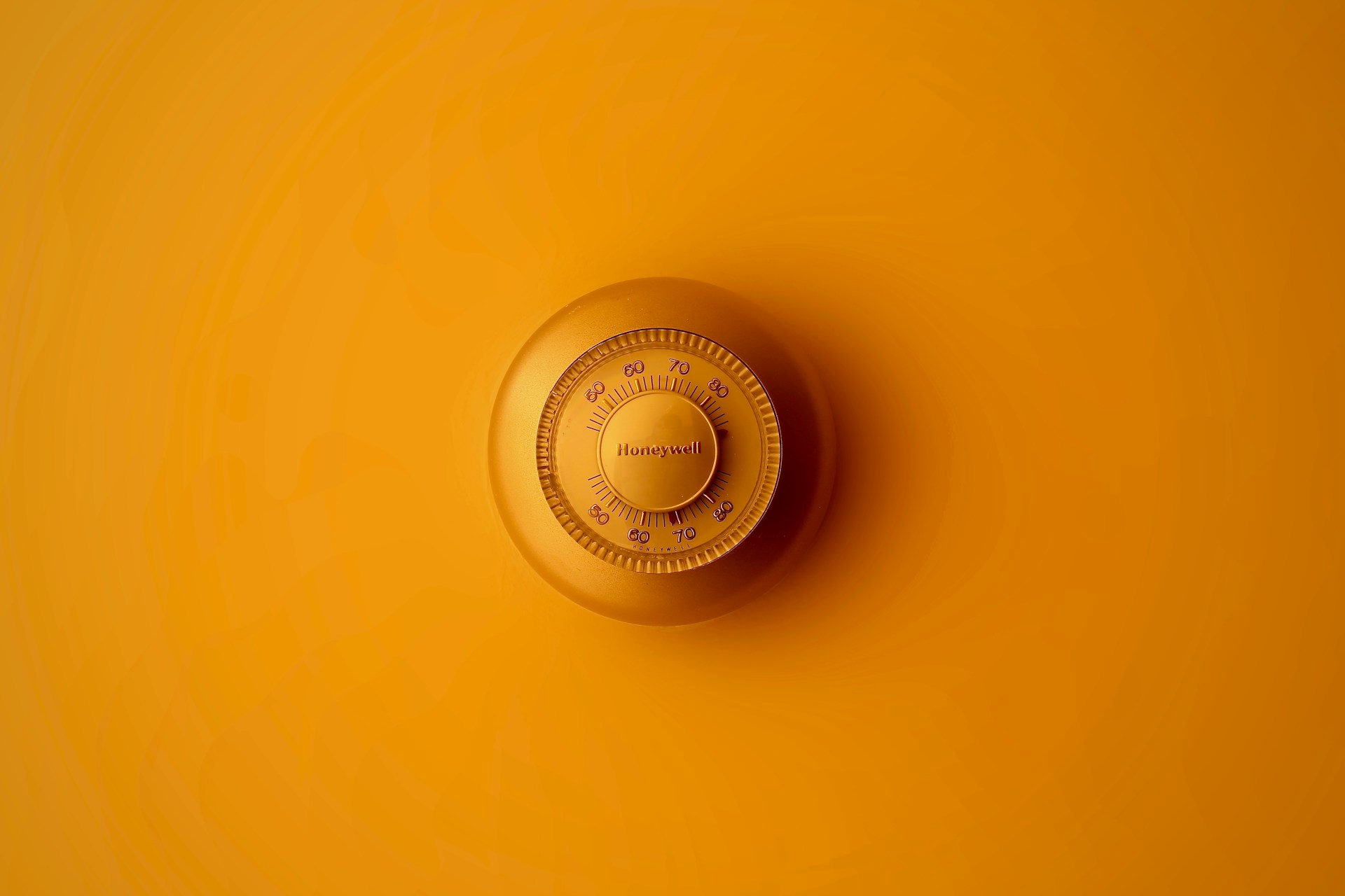 Gold colour Thermostat on gold coloured background
